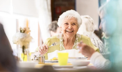 Lady enjoying a happy luxury meal