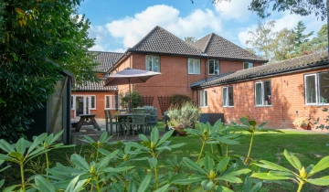 Take in the beautiful exterior view of Heron Lodge Care Homes, located in Wroxham