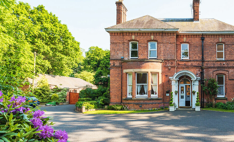 Take in the beautiful exterior view of Sharston House Care Home, located near Knutsford